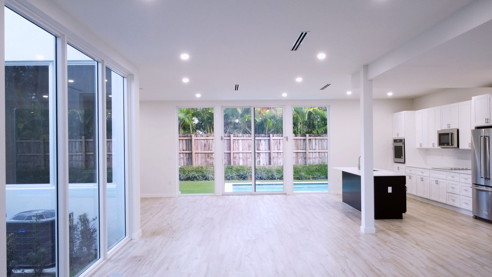 Open living area with pool view